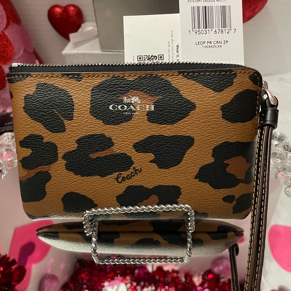 Coach Handbags - For Erin only NWT COACH OCELOT LEOPARD PRINT LEATHER WRISTLET